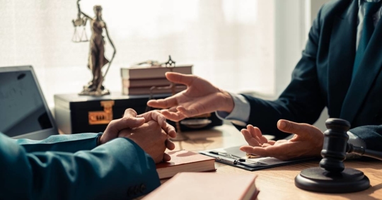 Client consulting to an attorney concept